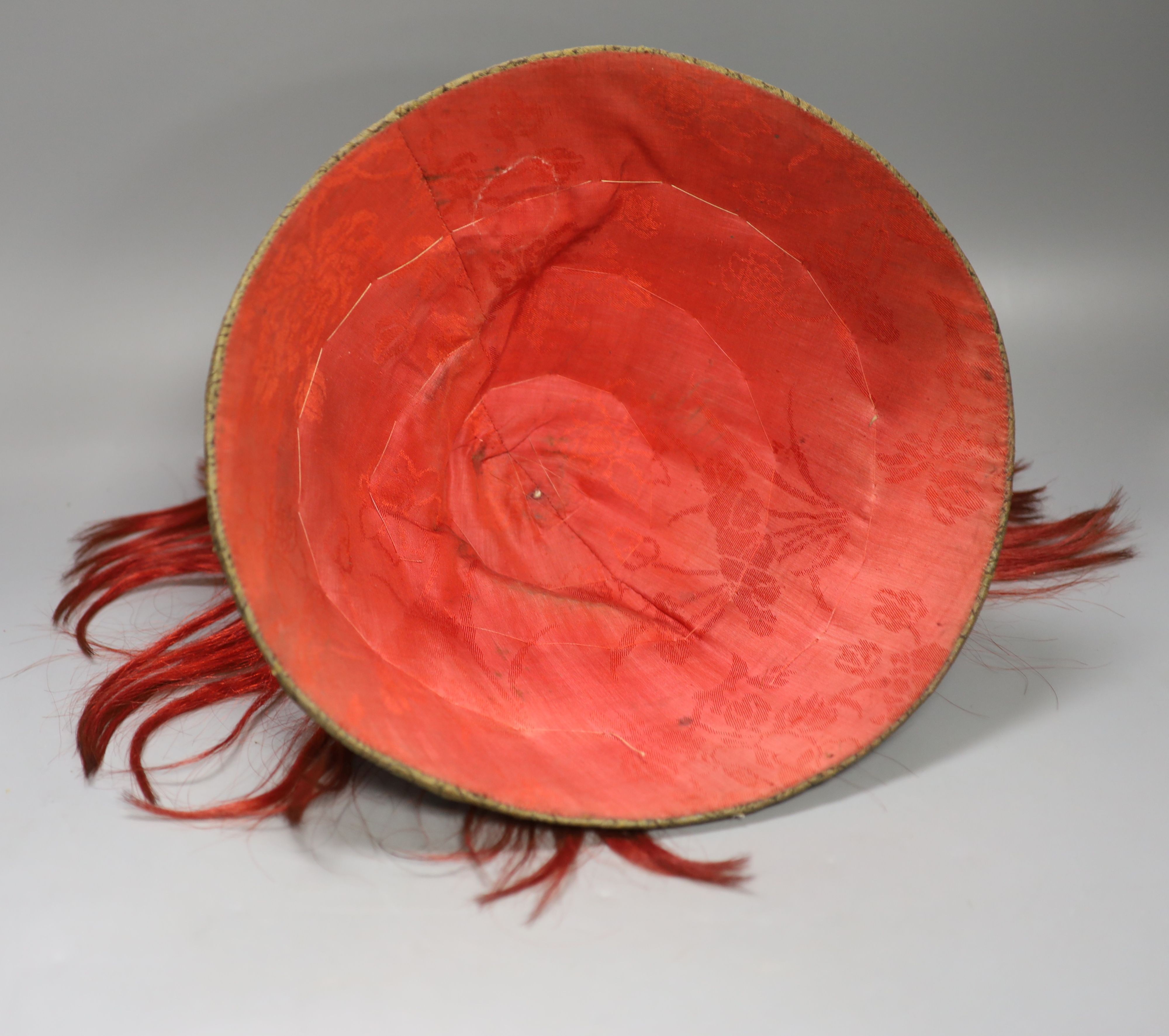 A Chinese late Qing mandarin hat, with gilt finial and original hide case